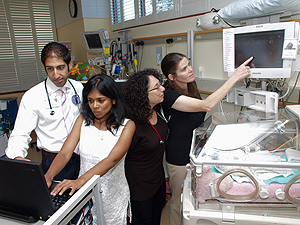 Pictured in the neonatal intensive <br> care unit at Lucile Packard Children’s Hospital are<br> Anand Rajani, MD; <br>Suchi Saria; Anna Penn, MD, PhD; <br>and Daphne Koller, PhD.